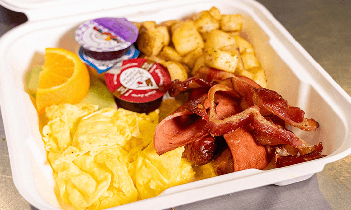 Scrambled eggs, bacon, and home fries
