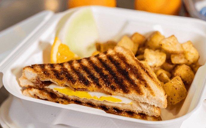 Grilled egg sandwich with home fries